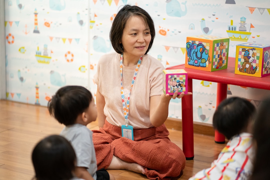 Teacher shows colorful blocks to young children